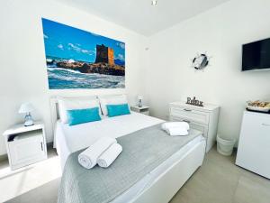 Postel nebo postele na pokoji v ubytování Torre Pozzillo Beach