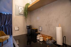 a room with a table with a coffee maker on it at Cúpulas Del Valle by Villa De La Rosa in Ensenada