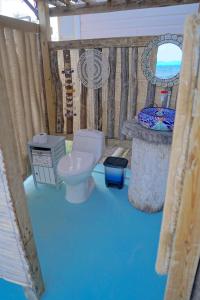 a model of a bathroom with a toilet and a sink at Golden Sea Casa Boutique in Archibolds