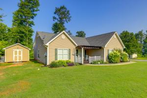 a house with a green lawn at Charming Newnan Getaway about Mins to Downtown! in Newnan