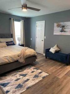 a bedroom with a bed and a ceiling fan at Beautiful Home In Greenville in Greenville