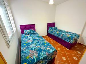 Postel nebo postele na pokoji v ubytování Residence Al Kasaba - Spacious apartment with swimming pool and direct access to sea + 11 fotografií