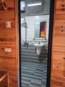 a bathroom with a sink and a mirror at Hmong Eco Villas in Sa Pa