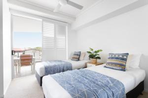 Ένα ή περισσότερα κρεβάτια σε δωμάτιο στο Aspect Caloundra