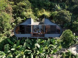 a house on top of a hill with trees at Casa Zafiro in Monteverde Costa Rica
