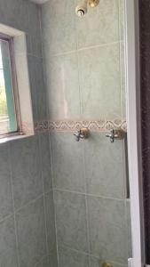 a bathroom with a shower with a glass door at Mirador in Monterrey