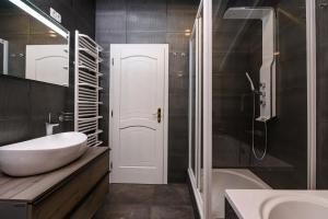 a bathroom with a sink and a toilet and a tub at Villa Del Mar Omiš in Omiš +49 photos
