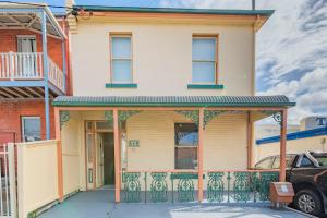 a house with a gate in front of it at 4 Bedroom House - Hobart CBD - Free Parking - Free WIFI in Hobart