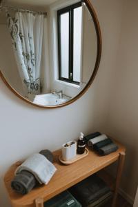 a bathroom with a sink and a mirror at Blackwattle Farm in Beerwah