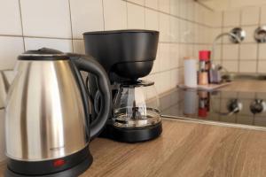 a coffee maker sitting on a counter in a kitchen at Essen-Steele, 2-Zimmer, 4 Person in Essen