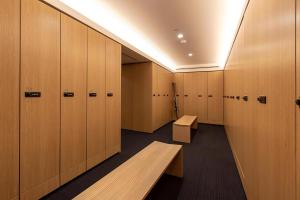 a row of wooden lockers in a locker room at The Maples Niseko in Niseko