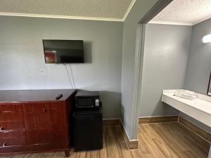 TV a/nebo společenská místnost v ubytování Studio Suites
