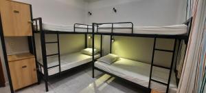 Postel nebo postele na pokoji v ubytování Long Hostel