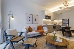 a living room with a couch and a table at ViiA Residences Kuala Lumpur, Five Senses in Kuala Lumpur