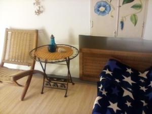 a living room with a table and a chair at Apartman MICHI in Sveti Juraj