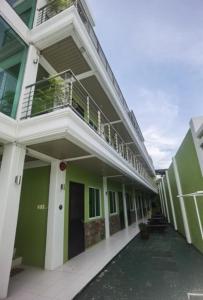 an external view of a building with a balcony at Delta Star Manor in Naga