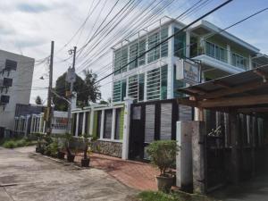 a building with plants in front of it at Delta Star Manor in Naga