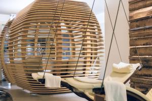 a room with a large window with towels hanging from it at Pfefferkorn's Hotel in Lech am Arlberg