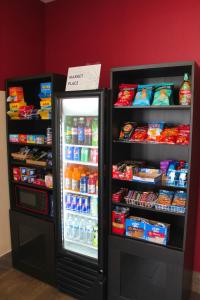 a refrigerator filled with lots of food and drinks at Ramada by Wyndham Harrisonburg in Harrisonburg