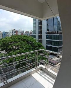 a balcony with a view of a city at Hotel Skylink in Dhaka