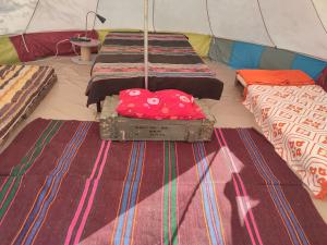 a group of four beds in a tent at Camping Kromidovo in Kromidovo