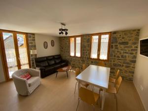 a living room with a couch and a table at Apartamento Casa Francho 3 in Panticosa