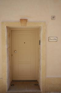 a garage door in a room with a brick wall at Maison de luxe in Francavilla Fontana
