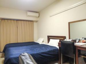Postelja oz. postelje v sobi nastanitve HOTEL LiVEMAX BUDGET Nagoya