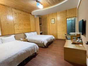 Letto o letti in una camera di Dragon Manor Resort