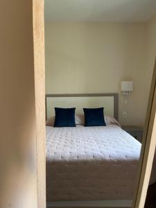 Postel nebo postele na pokoji v ubytování Hotel Maquis et Mer