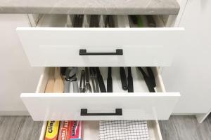 a white drawer filled with lots of knives at LOVELY PET FRIENDLY SELF CONTAINED HOLIDAY VILLA in Bongaree