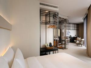 Katil atau katil-katil dalam bilik di Orient Luxury Hotel-Jiaoxi