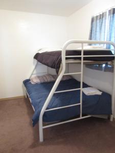 A bunk bed or bunk beds in a room at All Seasons Campground