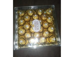 a box of gold filled chocolates on a table at Hotel Leisure, Ahmedabad in Ahmedabad