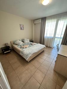 a bedroom with a bed and a tiled floor at Summer Dreams B26 in Sunny Beach +30 photos