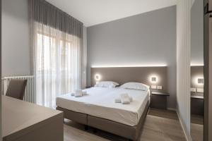 Postel nebo postele na pokoji v ubytování Hotel Excelsior Pavia + 37 fotografií