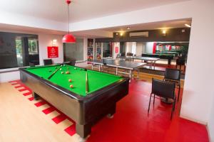 a room with a pool table and ping pong ball at 7 Apple Resort, Lonavala in Lonavala