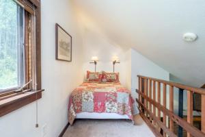 a bedroom with a bed in the corner of a room at Manitou Lodge 7 by Alpine Lodging Telluride in Telluride