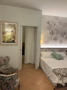 Ένα ή περισσότερα κρεβάτια σε δωμάτιο στο Casa Margheri