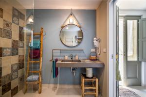 a bathroom with a sink and a mirror at La dimora Elia' in Muro Leccese +19 photos