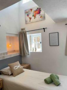 a bedroom with a bed and a window at vakantiewoning Emponse 7 in Le Plan-de-la-Tour