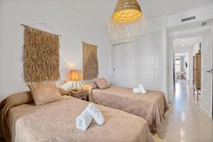 Ein Bett oder Betten in einem Zimmer der Unterkunft Villa Gadea 7-2