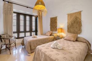 Ein Bett oder Betten in einem Zimmer der Unterkunft Villa Gadea 7-2