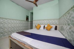 Letto o letti in una camera di SPOT ON Hotel Ramgiri