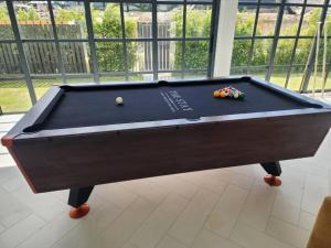 a pool table with balls on top of it at The Stay Huahin 2 in Khao Tao