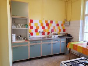 a kitchen with a sink and a counter at Muskátli Üdülőház in Parádfürdő-Peres