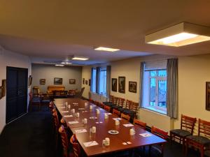 a large dining room with a long table and chairs at Hotel Postgaarden in Fredericia