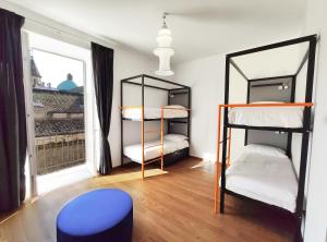Postel nebo postele na pokoji v ubytování Tric Trac Hostel