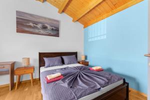 Ein Bett oder Betten in einem Zimmer der Unterkunft Villa Maria Tadini