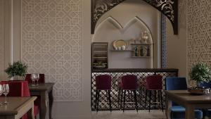 a dining room with a table and some chairs at Reikartz Sote Tashkent in Tashkent